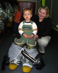 toddler gets taller with firefighter boots